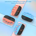 Protezioni per le nocche da boxe per 2 controller Joy-Con di Nintendo Switch - 2 pezzi - Arancione / Blu