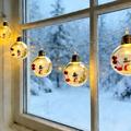 Luci LED a catena natalizie con pupazzi di neve e palline trasparenti – 10 LED bianco caldo - 2m